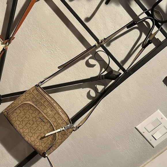 Calvin Klein Handbags - New!! Never used. Needs a new home where she will be loved.